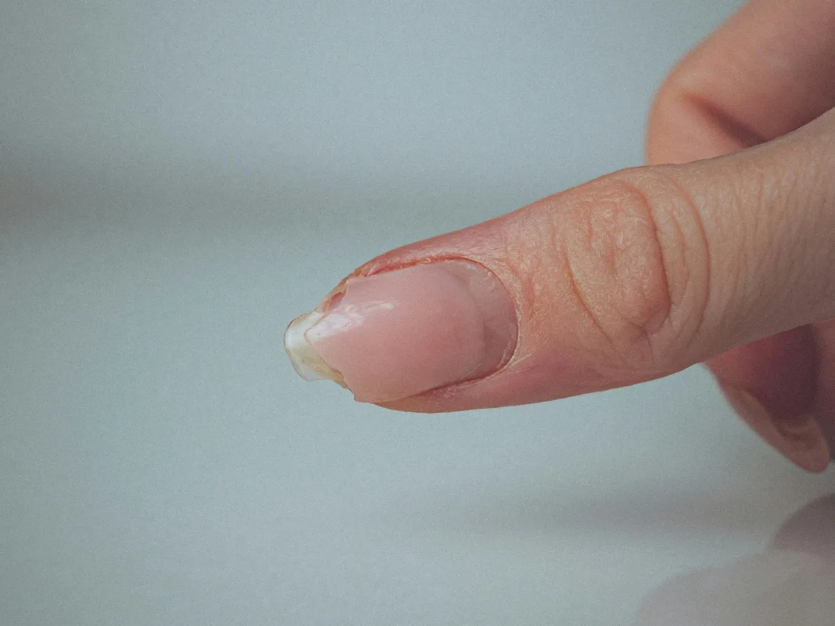 Close-up of a dull, low-shine nail polish finish compared to a glossy one